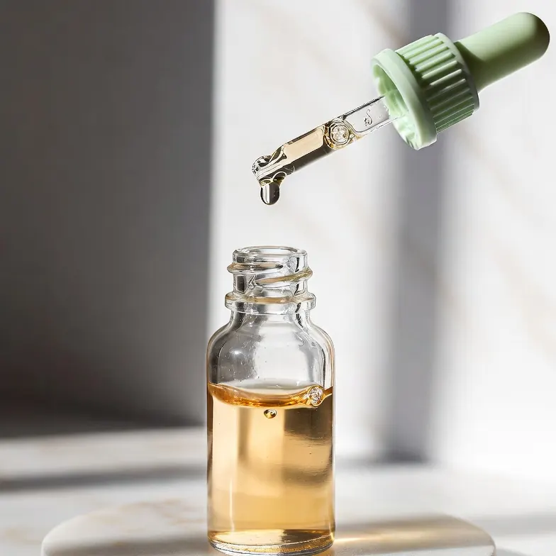 Glass dropper bottle of multi-peptide hair density serum